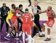  ?? Marcio Jose Sanchez / Associated Press ?? Chris Paul, second from left, is restrained by the Lakers' LeBron James after his Saturday altercatio­n with Rajon Rondo.