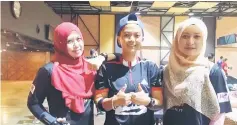  ??  ?? Yusralina Yusof (right) of 77 United Bowlers with teammates Salehah Saleh (left) and Liziana Bundang.