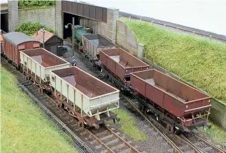  ??  ?? Coal hoppers of various types and eras are present in this view of an industrial customer’s exchange siding. The unfitted HOP21 and early rebodied wagons could work together in the early 1970s, but the former would likely be in much worse external condition than shown!