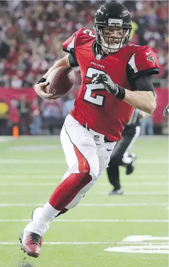  ?? CURTIS COMPTON/THE ASSOCIATED PRESS ?? Atlanta Falcons quarterbac­k Matt Ryan runs for a touchdown against the Green Bay Packers during the first half on Sunday in Atlanta. The Falcons won 44-21.