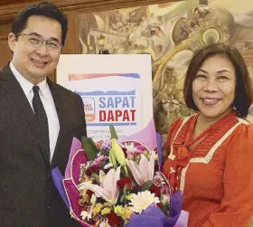  ??  ?? Bayad Center president and CEO Manuel Lorenzo Tuason with Department of Education Undersecre­tary Lorna Dig Dino.