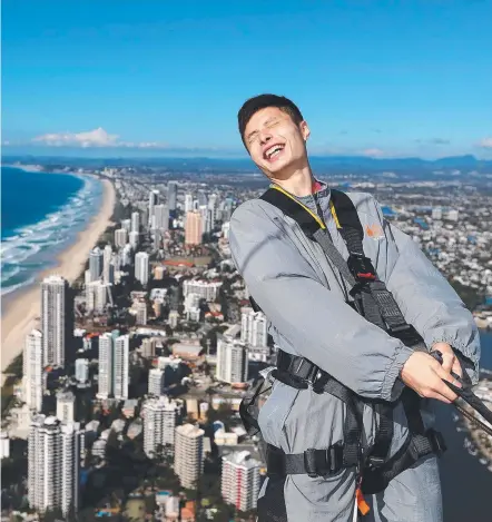  ?? Picture: CHRIS HYDE ?? Champion badminton player Shi Yuqi, of China, on top of the Q1 in Surfers Paradise yesterday.