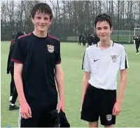  ??  ?? ●● Stanley Hughes and Matthew Lowe in Year 11 completed 10,000 steps in one PE lesson.