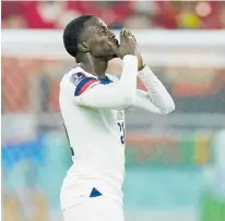  ?? Photo / AP ?? Tim Weah blows kisses to the fans after getting on the scoresheet for the US in a match that Wales drew with a late penalty.