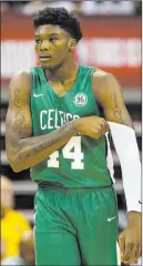  ??  ?? Robert Williams, Boston’s first-round pick, injured his left knee and left the game early against the 76ers on Friday night.