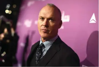  ?? JORDAN STRAUSS/INVISION ?? Michael Keaton, at a party for Oscar nominees thrown by the Hollywood Reporter, is no longer a sure bet for a Best Actor award for Birdman. He may have been eclipsed by Eddie Redmayne in The Theory of Everything.