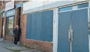  ?? STAFF ?? Andrea Mayer, of Wills Printing Co., stands outside her family business on Patapsco Avenue in Brooklyn, next to the blighted property that caused her headaches for years.