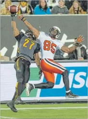  ?? HAMILTON SPECTATOR FILE PHOTO ?? Hamilton Tiger-Cats’ Delvin Breaux, left, breaks up a pass intended for B.C. Lions’ Shawn Gore in October 2014.