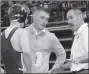  ?? RICK PECK/SPECIAL TO MCDONALD COUNTY PRESS ?? McDonald County wrestling coach Josh Factor (right) talks strategy with Oscar Ortiz, while son and assistant coach Cody Factor look on during a break in Ortiz’s semifinal win.