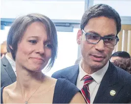  ?? RYAN REMIORZ / THE CANADIAN PRESS ?? Quebec politician Gerry Sklavounos and wife, Janneke, who performed her duty in service of her husband’s comeback by staying poker faced during his press conference.