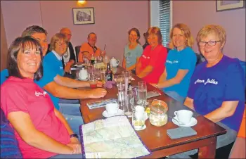  ?? Photograph­s: Janice Small ?? The Arran Belles and support team discuss the route before setting off on their adventure.