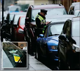  ?? Picture:Colin Mearns ?? A traffic warden patrols along West George Street in Glasgow city centre