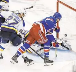  ?? AP ?? Jimmy Vesey shoots the puck past St. Louis goaltender Jordan Binnington on Friday night at the Garden.