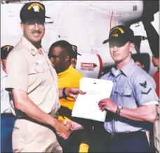  ??  ?? Chris Snow received the flag letter from Rear Admiral Peter A. C. Long of Commander Cruiser Destroyer Group 5.