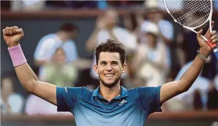  ?? AFP PIC ?? Dominic Thiem celebrates after defeating Roger Federer 3-6, 6-3, 7-5 to win the Indian Wells title on Sunday.