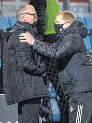  ??  ?? ALL THE BEST: John Hughes, left, with Neil Lennon before kick-off last Sunday.