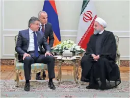  ??  ?? Iranian President Hassan Rouhani (R) meets Armenian Prime Minister Karen Karapetyan in Tehran on Tuesday. president.ir