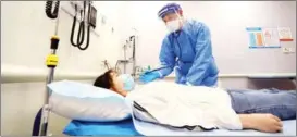  ?? PROVIDED TO CHINA DAILY ?? Niels DeConinck, a French doctor, treats a non-COVID-19 patient at Jiahui Internatio­nal Hospital in Shanghai on April 28.