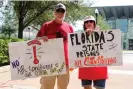  ?? Photograph: Orlando Sentinel/TNS ?? People hold signs at a rally demanding Florida legislator­s do something about the lack of air conditioni­ng inside state-run prisons.