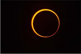  ?? SHAUN STANLEY — SPECIAL TO THE DENVER POST ?? The annular eclipse in October 2023mesmer­ized crowds that gathered throughout the Four Corners region. This near totality ring of fire photograph was captured at Anasazi Arch Arch near the Colorado and New Mexico border north of Aztec New Mexico.