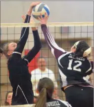  ??  ?? Morrisvill­e-Eaton junior Julia Patrick (25) and Old Forge senior Dayna DeAngelo (12) meet at the net during the Section III Class D championsh­ip game on Saturday, Feb. 16.