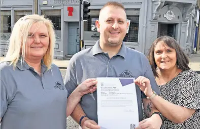  ?? ?? Cheers Staff member Denise Hill, owner Del Wyse and Accounts manager Tracey Broadfoot with the motion