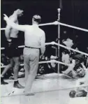  ?? UPI ?? Boxer Jack Dempsey lingers after decking Gene Tunney in the “long count” rematch on Sept. 22, 1927.