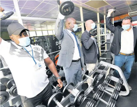  ?? RUDOLPH BROWN/PHOTOGRAPH­ER ?? From left: Aeon Wright, Red Stripe/Heineken Sport Club trainer, with Zavia Mayne, minister of state in the Ministry of Labour and Social Security; Luis Prata, managing director of Red Stripe; and Michael Grayer, supply chain director of Red Stripe, at the employee multipurpo­se facility.