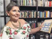  ??  ?? Luz Marina Tovar with a prized copy of
above, at The Alfiz hotel in Cartagena