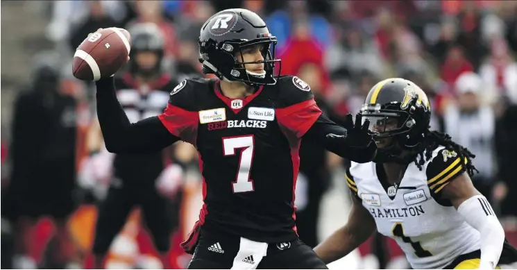  ?? JUSTIN TANG/THE CANADIAN PRESS ?? Redblacks quarterbac­k Trevor Harris threw a CFL playoff-record six touchdown passes in Ottawa’s East Division Final win over Hamilton on Sunday.