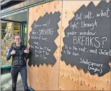  ??  ?? Kelsey Ward next to the replacemen­t blackboard­s on the Highland Bookshop front. Photograph: Iain Ferguson