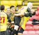  ??  ?? BUZZING: Watford’s Will Hughes is lifted high after his strike