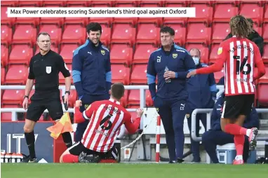  ??  ?? Max Power celebrates scoring Sunderland’s third goal against Oxford