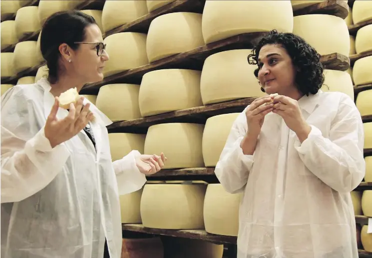  ?? NETFLIX ?? Samin Nosrat, right, stars in Netflix’s new cooking documentar­y series Salt, Fat, Acid, Heat, which features more women than many other travel cooking shows.