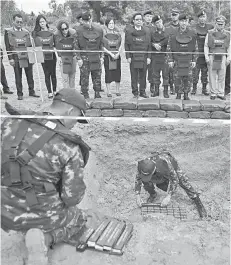  ??  ?? Chaichana (front row, second right) and officials from Japan, Norway and the US oversees soldiers stacking anti-personnel mines during the official Destructio­n Ceremony of Thailand’s Retained Anti-Personnel Mines 2019 event by the Royal Thai Armed Forces in the western Thai province of Sa Kaeo.