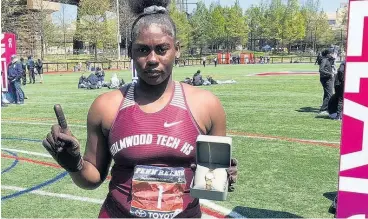  ?? ROBERT BAILEY ?? Holmwood Technical High School’s Cedricka Williams displays her Penn Relays commemorat­ive watch after she won the Championsh­ip of America girls’ discus throw with a personal best 54.00m in Philadelph­ia, United States, on Thursday.