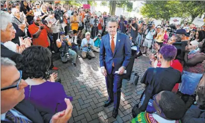  ?? Joe Mahoney The Associated Press ?? Gov. Ralph Northam walks away after speaking Tuesday at a rally against gun violence on the Virginia State Capitol grounds in Richmond, Va. Lawmakers adjourned less than two hours after starting a special session called in response to a mass shooting.