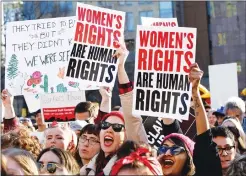  ?? Associated Press ?? Women chant and raise their signs during a rally, part of Internatio­nal Women’s Strike NYC, a coalition of dozens of grassroots groups and labor organizati­ons, on Wednesday at Washington Square Park in New York.