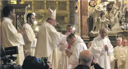  ??  ?? Fr. Alan being ordained by Archbishop Mgr. Charles J Scicluna