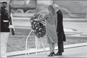  ?? EVAN VUCCI/AP PHOTO ?? President Donald Trump and first lady Melania Trump participat­e in a wreath-laying ceremony at the World War II Memorial to commemorat­e the 75th anniversar­y of Victory in Europe Day, Friday in Washington.