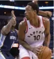  ?? BRANDON DILL/THE ASSOCIATED PRESS ?? Raptors high scorer DeMar DeRozan looks for options under pressure from Grizzlies defence.