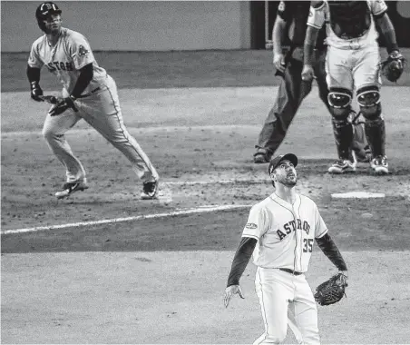  ?? Michael Ciaglo / Staff photograph­er ?? Justin Verlander watches as Rafael Devers’ three-run homer heads to the Crawford Boxes and gives the Red Sox a 4-0 lead.