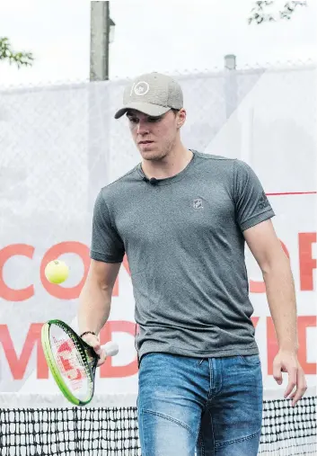  ?? CHRISTOPHE­R KATSAROV/THE CANADIAN PRESS ?? Connor McDavid attends a promotiona­l event Wednesday in Toronto ahead of the Rogers Cup tennis tournament, where the Edmonton Oilers star said “it’s disappoint­ing” to know Canada’s best hockey players will not be representi­ng their country at the 2018...