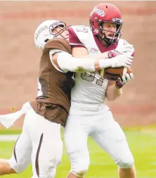  ?? DOUGLAS KILPATRICK/SPECIAL TO THE MORNING CALL ?? Lehigh defensive back Sam McCloskey knocks the ball out of the hands of Colgate wide receiver Owen Rocket during a 2018 Patriot League game.