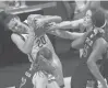  ?? BRAD HORRIGAN/HARTFORD COURANT ?? UConn forward Olivia NelsonOdod­a, left, rips the ball away from Marquette forward Chloe Marotta in the Big East Tournament championsh­ip at Mohegan
Sun Arena on Monday night in Uncasville. UConn won 73-39.