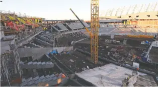  ?? TROY FLEECE FILES ?? tour around the constructi­on of the Mosaic Stadium; at left, Michael Fougere, elected October 2012.