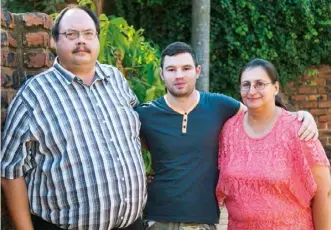  ??  ?? LEFT: André van Wyk, who handed himself over to police in connection with the murder and mutilation of Anika Smit (FAR LEFT), is now a free man. ABOVE: With his parents, Jan and Judie. BELOW: A picture taken in his cell during the year he spent in jail.
