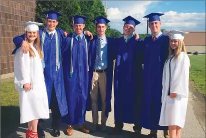  ?? Photos by Brendan McGair ?? Pictured from left, Angie Gagne, Tommy Beauchemin, Sean Doris, Nick Juckett, Alec Bridges, Noah Duquette, and Abby Maziarz gather just before commenceme­nt ceremonies begin at the CCRI Lincoln campus on Friday.