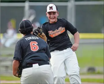  ?? SARAH GORDON/THE DAY ?? Montville´s Jack Treat and Eddie Torres (6) celebrate a double play during Montville’s 3-1 victory over East Lyme in the District 10 Little League baseball championsh­ip game on Tuesday at East Lyme.