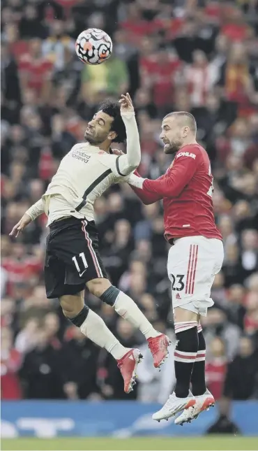  ?? ?? 0 Luke Shaw tries to get to grips with Mohamed Salah during Manchester United’s 5-0 defeat